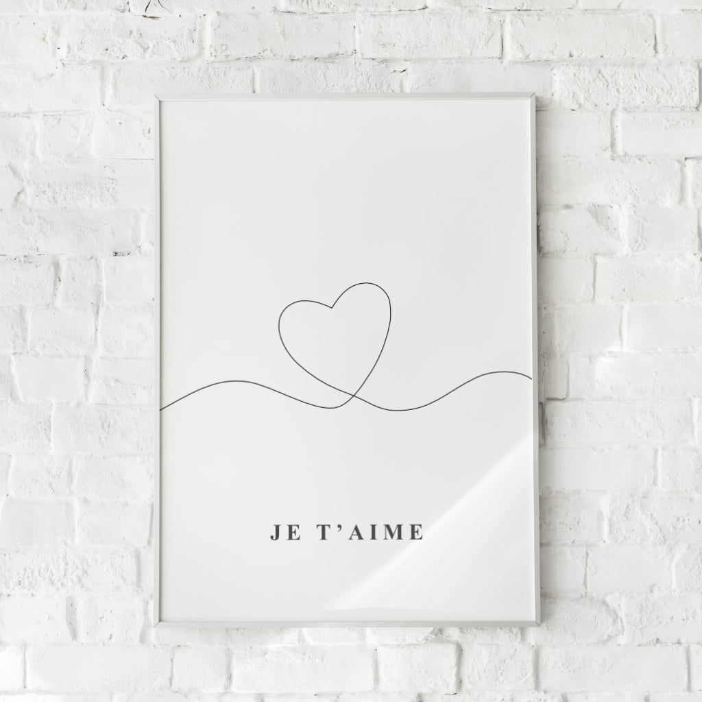 Minimalistisk plakat med et enkelt hjerte og teksten "Je t'aime".