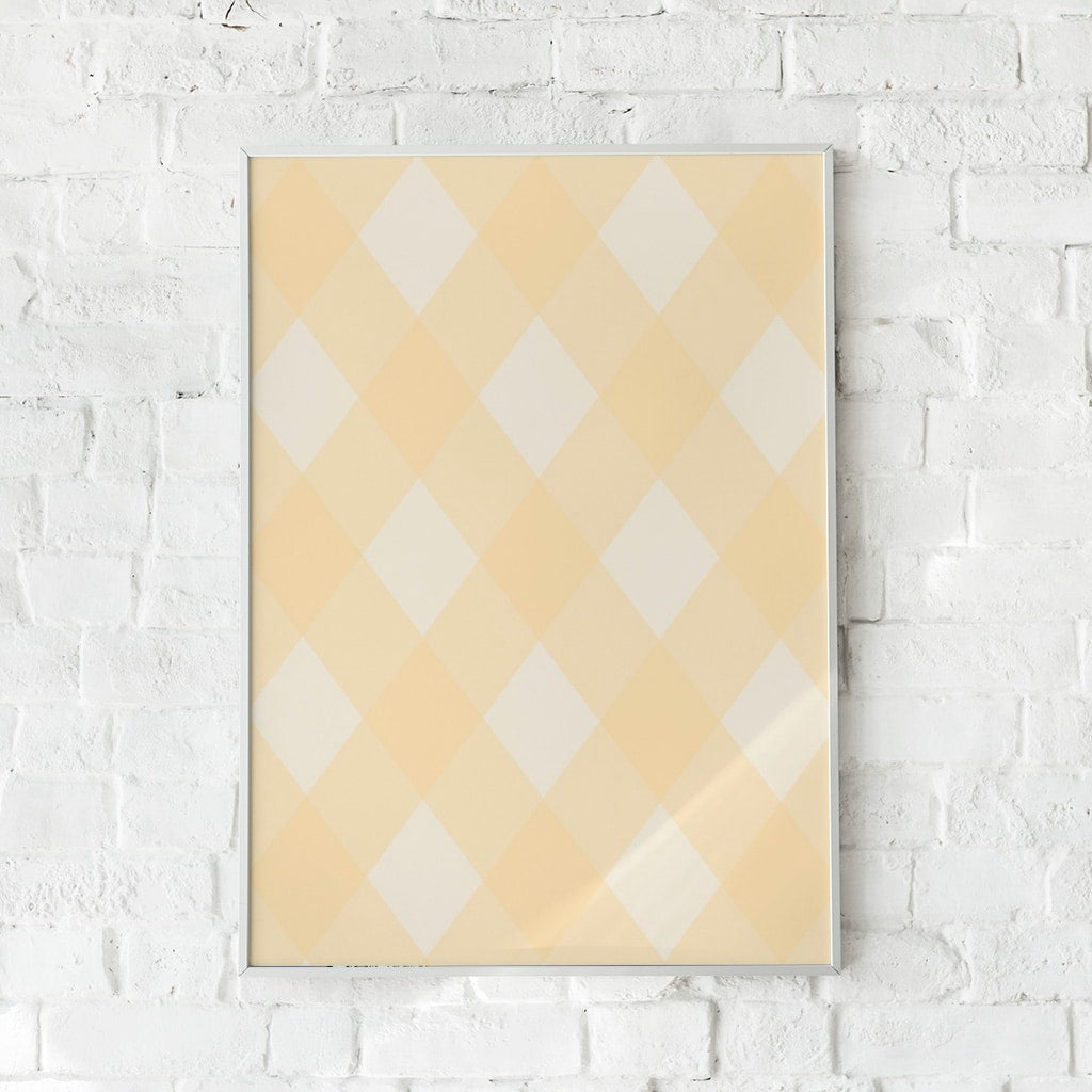 Plakat med geometrisk mønster i gule og beige nuancer.	